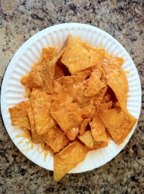 Nacho cheese chips and melted cheddar cheese